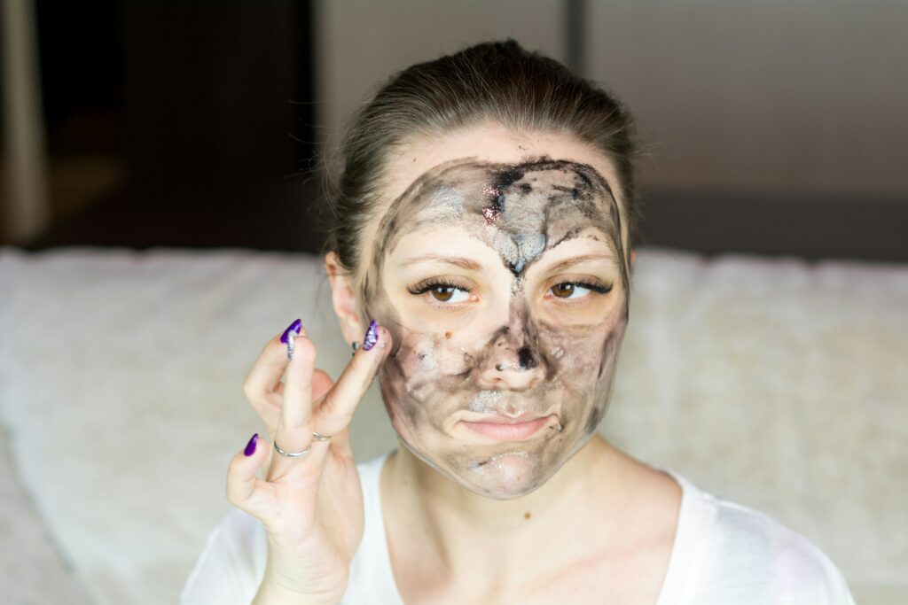 Girl using an acne face mask